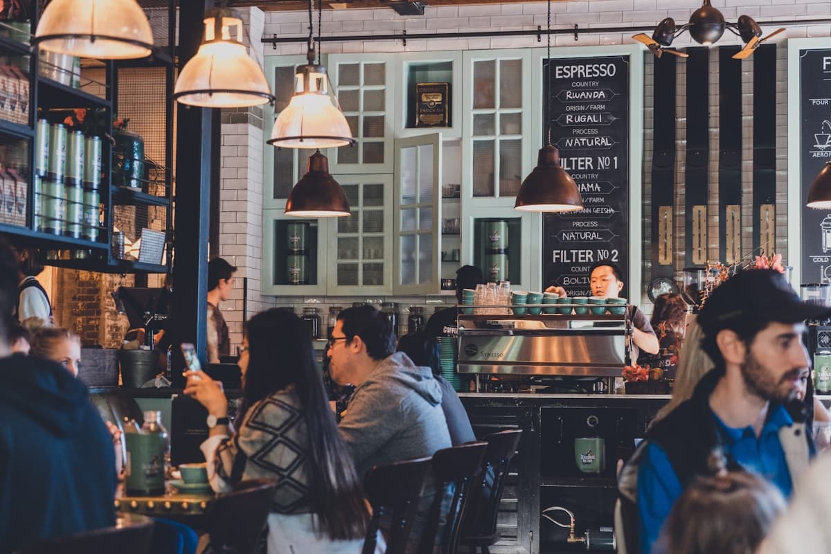 Guests talking in a busy coffee shop