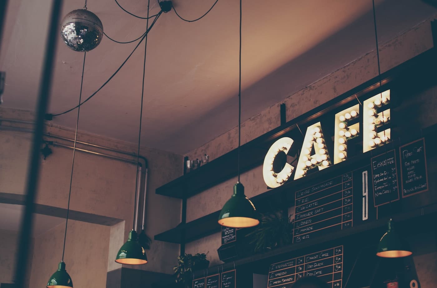 Neon café sign over a counter